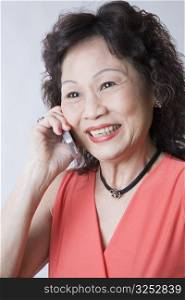 Close-up of a senior woman talking on a mobile phone and smiling