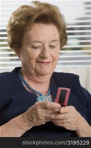 Close-up of a senior woman text messaging