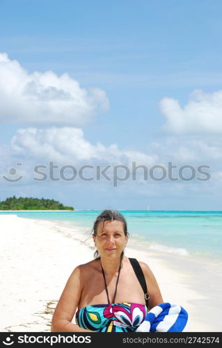 close up of a senior woman walking on a Maldivian Island