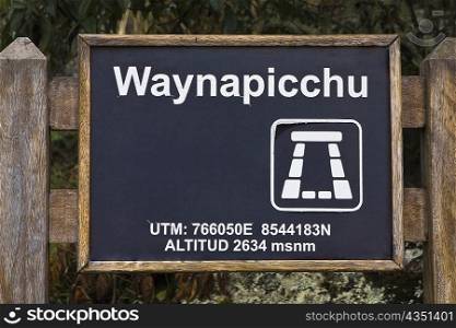 Close-up of a signboard, Aguas Calientes, Mt Huayna Picchu, Machu Picchu, Cusco Region, Peru