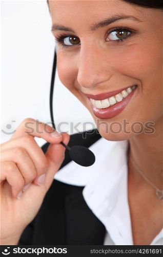 Close up of a smiling telephonist