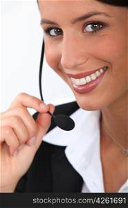 Close up of a smiling telephonist