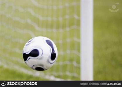 Close-up of a soccer ball in mid-air