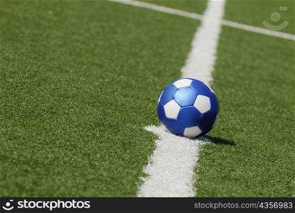 Close-up of a soccer ball placed on a yard line
