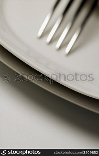 Close-up of a stack of plates and a fork