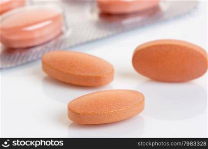 Close up of a Statin tablet - the controversial cholesterol lowering drug. Shallow d o f