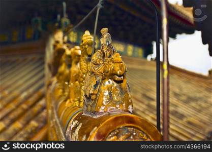 Close-up of a statue on the roof of a building, Tower Of Buddhist Incense, Summer Palace, Beijing, China