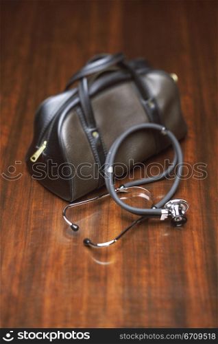 Close-up of a stethoscope and a doctors bag