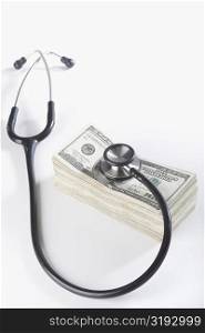 Close-up of a stethoscope on paper currency