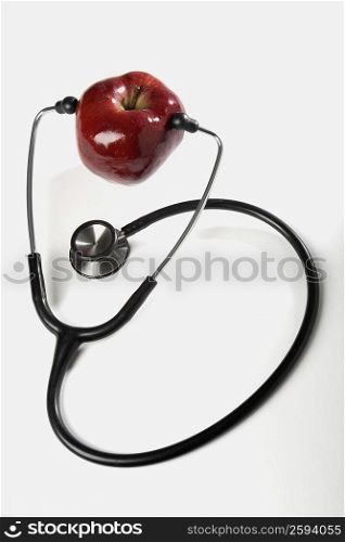 Close-up of a stethoscope with an apple