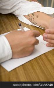Close-up of a student copying in an examination