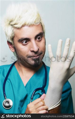 Close-up of a surgeon wearing surgical gloves