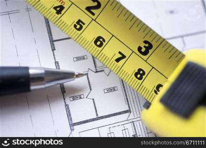 Close up of a tape measure and pen