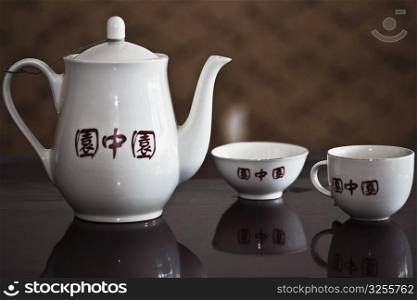 Close-up of a teapot with teacups, HohHot, Inner Mongolia, China