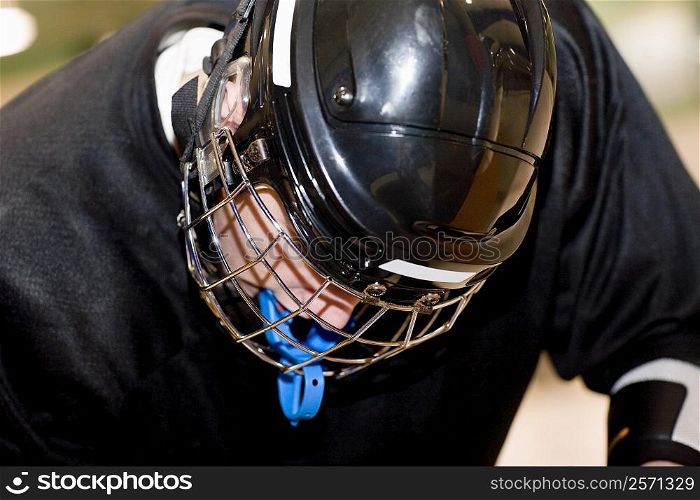 Close-up of a teenage boy in a goalie mask