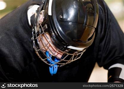 Close-up of a teenage boy in a goalie mask