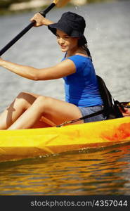 Close-up of a teenage girl kayaking