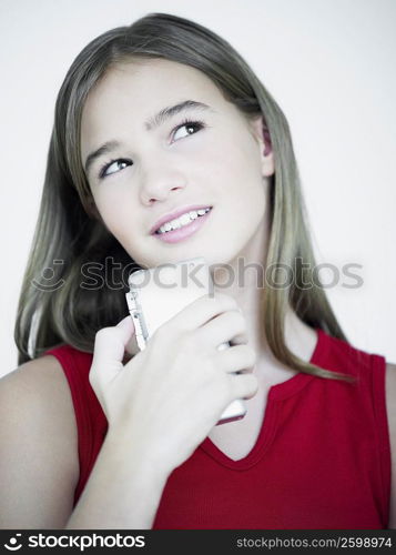 Close-up of a teenage girl listening to a tape recorder