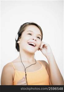 Close-up of a teenage girl listening to music