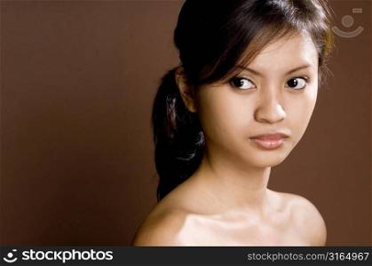 Close-up of a teenage girl looking away