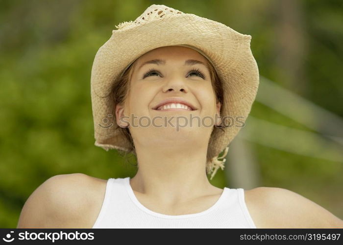 Close-up of a teenage girl looking up and smiling