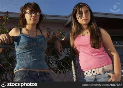 Close-up of a teenage girl standing with her sister