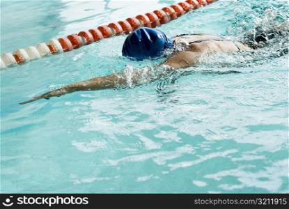 Close-up of a teenage girl swimming in a swimming pool