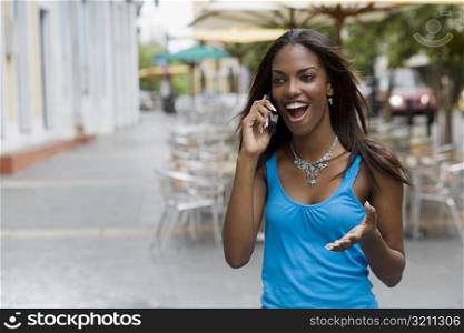 Close-up of a teenage girl talking on a mobile phone