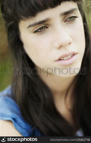 Close-up of a teenage girl thinking