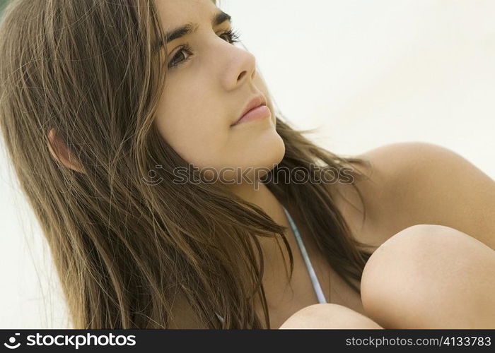 Close-up of a teenage girl thinking