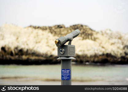 Close-up of a telescope on a beach, California, USA