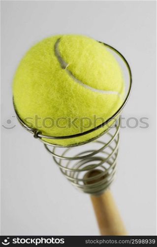 Close-up of a tennis ball on an egg beater