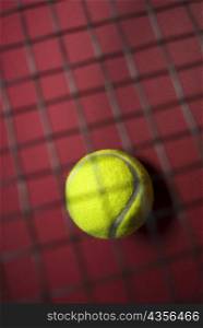 Close-up of a tennis ball with a net