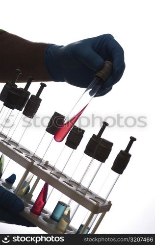 Close-up of a test tube in a person&acute;s hand