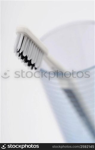 Close-up of a toothbrush in a glass