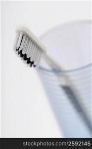 Close-up of a toothbrush in a glass