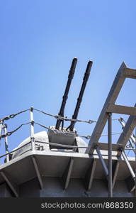 Close-up of a tower with a ship gun. Ship weapon tower. Naval exercises, attack, and defense.