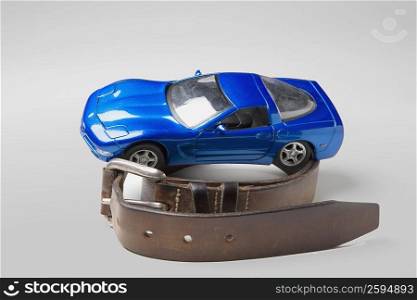 Close-up of a toy car on a belt