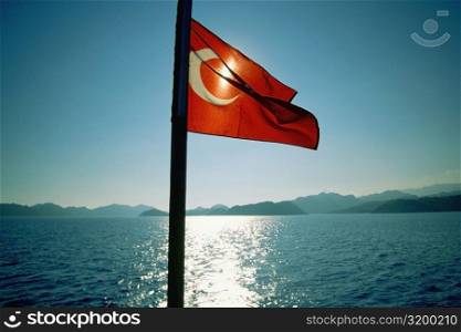 Close-up of a Turkish flag fluttering on a cruise ship, Kekova, Antalya, Turkey