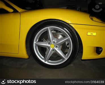 Close up of a tyre on a yellow sports car