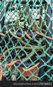 Close up of a UK lobster pot with green twine/net.