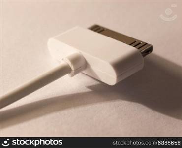 close up of a usb charger head for a mp3 player on a white background