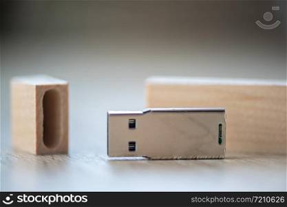 Close-up of a USB stick, flash pen. Wooden case.