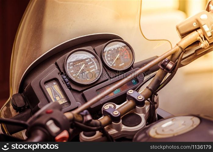Close up of a vintage motorcycle dashboard, road trip