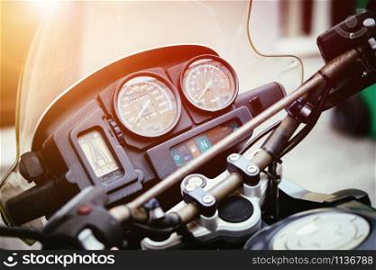 Close up of a vintage motorcycle dashboard, road trip