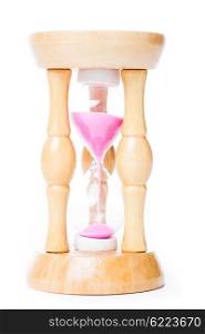 Close-up of a vintage sandglass with pink sand isolated on white. The old sandglass