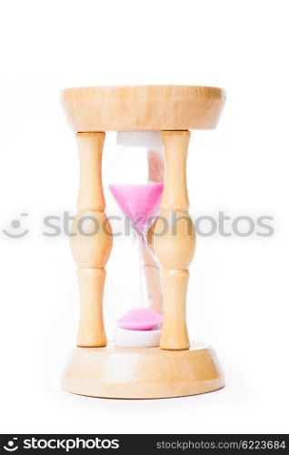 Close-up of a vintage sandglass with pink sand isolated on white. The old sandglass