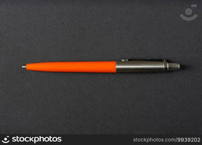 Close up of a vintage style Ballpoint pen on a dark gray background