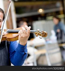 Close-up of a violinist playing a violin