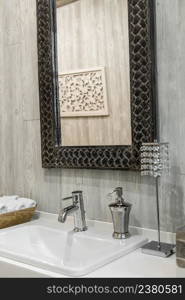 Close-up of a washbasin with a faucet in the bathroom. interior of the shower room